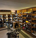 A wine store with a large collection of wine bottles. Description generated by AI
