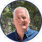 A man wearing a blue shirt and blue jeans. Description generated by AI