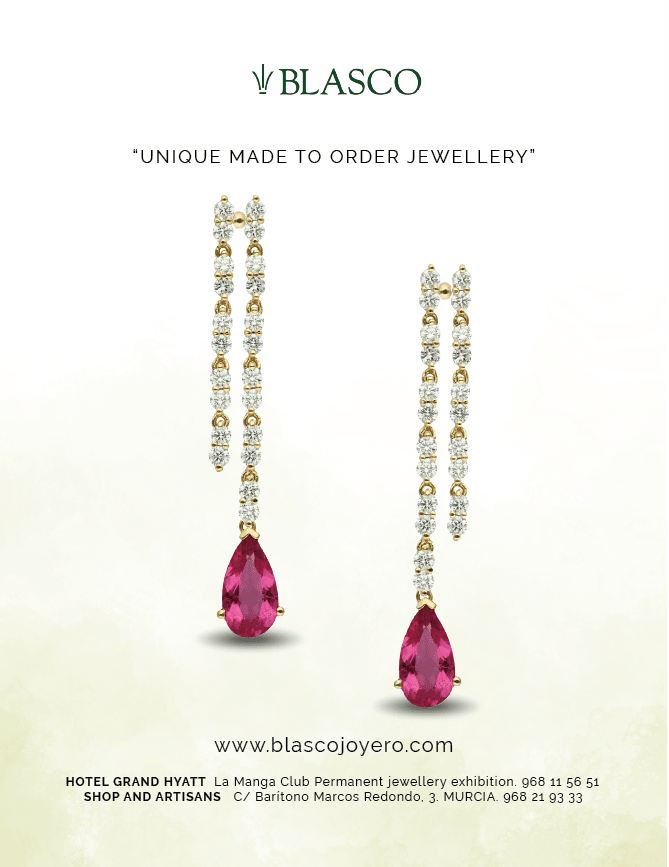 Two pink jewels on a necklace. Description generated by AI