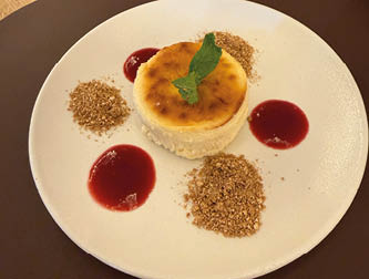A white plate with a dessert on it. Description generated by AI