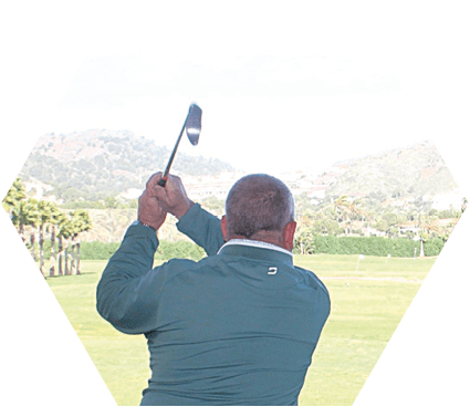 A man is swinging a golf club on a golf course. Description generated by AI