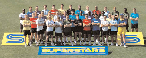 A group of people pose for a photo in front of a yellow sign that says “Superstars." AI generated content