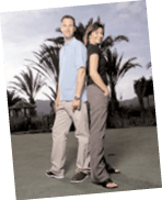 A man and woman pose together on a lush green field. AI generated content