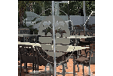 A restaurant with a logo on the window. Description generated by AI