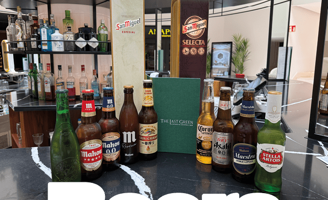 A table with a variety of beer bottles and a menu. Description generated by AI