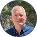 A man wearing a blue shirt and blue jeans. Description generated by AI