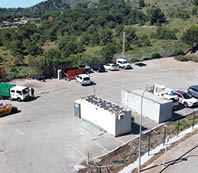 A parking lot with several cars and trucks parked. Description generated by AI
