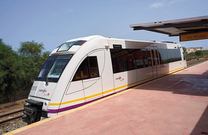 A train is on the tracks at a station. Description generated by AI