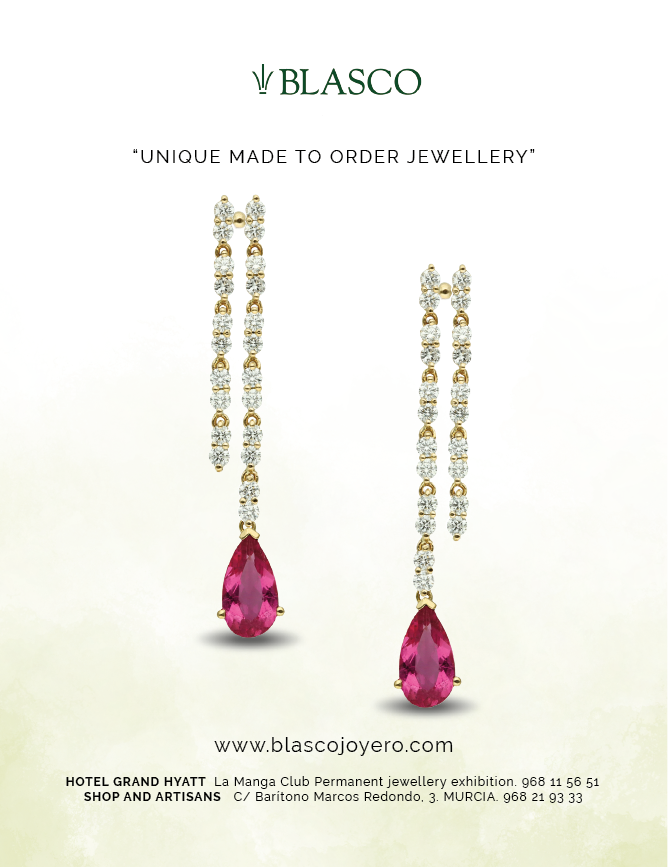 Two pink jewels on a necklace. Description generated by AI