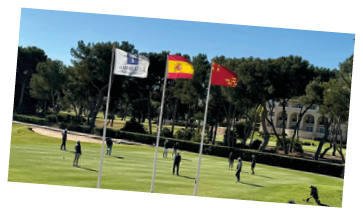 A group of people playing golf on a green course. Description generated by AI
