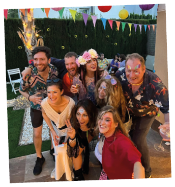 A group of people posing for a picture. Description generated by AI