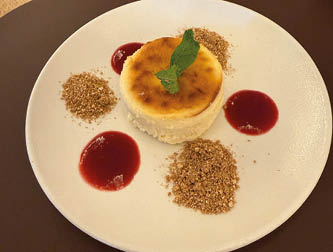 A white plate with a dessert on it. Description generated by AI