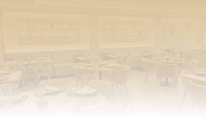A restaurant with a lot of tables and chairs. Description generated by AI