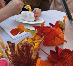 A table with a plate of food and a pumpkin on it. Description generated by AI