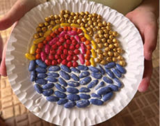 A plate with a sun and a beach scene on it. Description generated by AI
