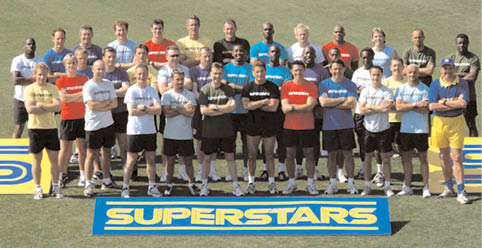 A group of people pose for a photo in front of a yellow sign that says “Superstars." AI generated content