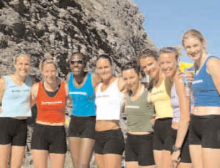 A group of women in athletic wear pose for a picture. AI generated content