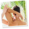 Osteopath doing a shoulder evaluation on a man flexing and rotating the joint to assess mobility